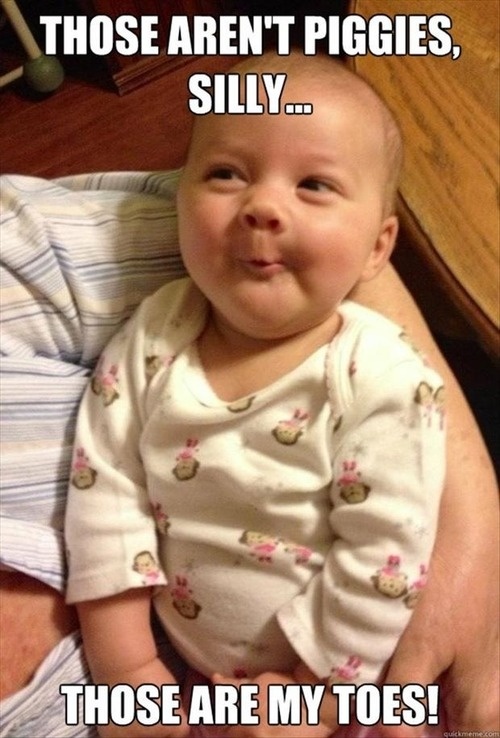 Baby smiling - Those aren't piggies, silly .. Those are my toes ! 